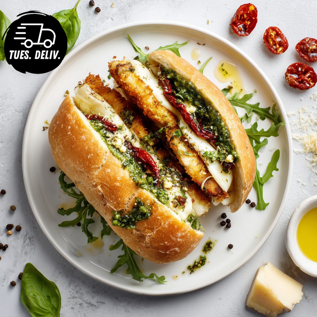 CHICKEN SCHNITZEL AND PESTO MELT PANINI.