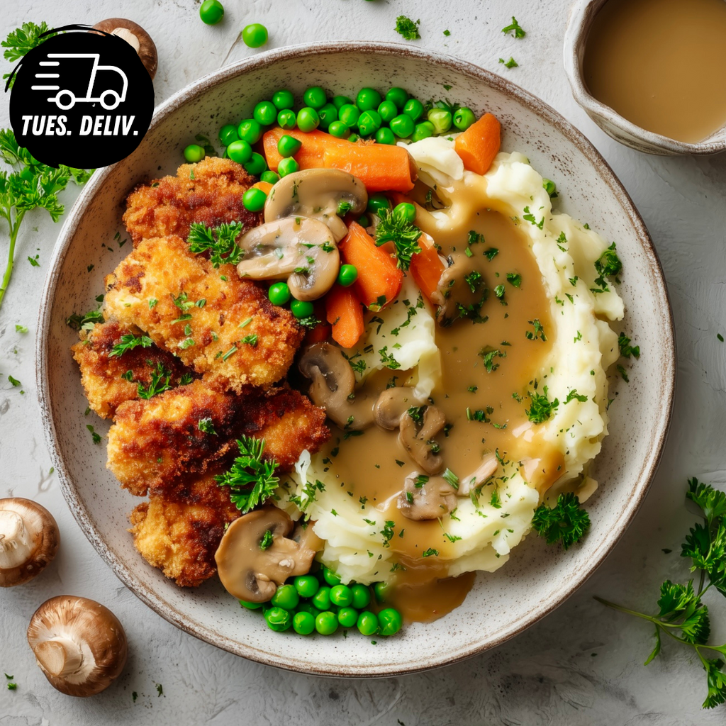 CHICKEN SCHNITZEL WITH MASH AND MUSHROOM GRAVY.