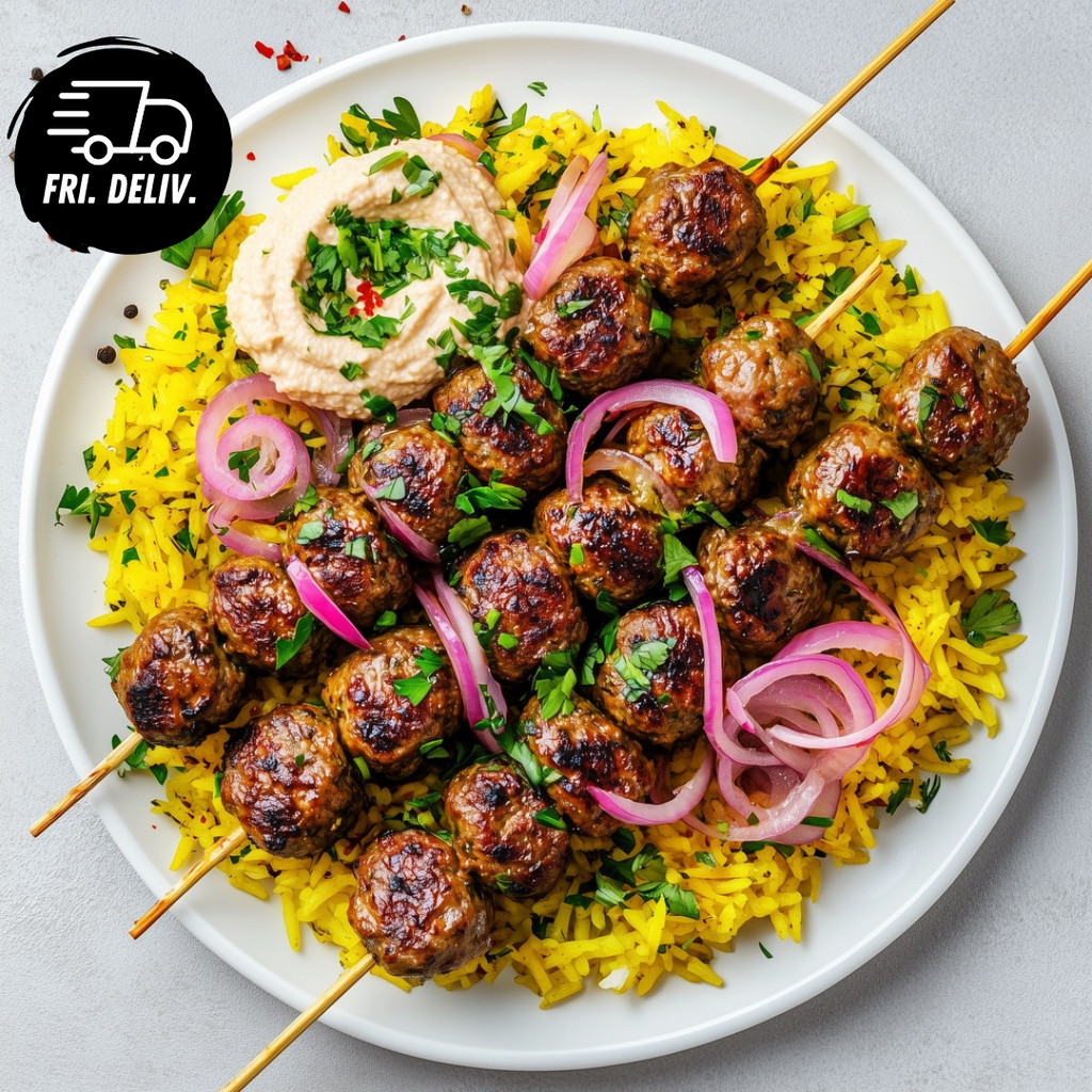 MEDITERRANEAN KOFTA WITH SPICED RICE TAHINI AND PICKLED ONION.