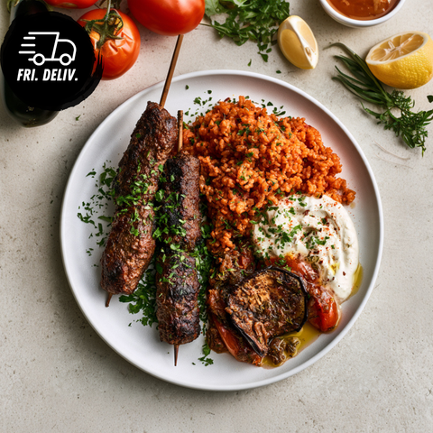 GRILLED KEFTA WITH TOMATO BULGUR, YOGHURT AND EGGPLANT RELISH.